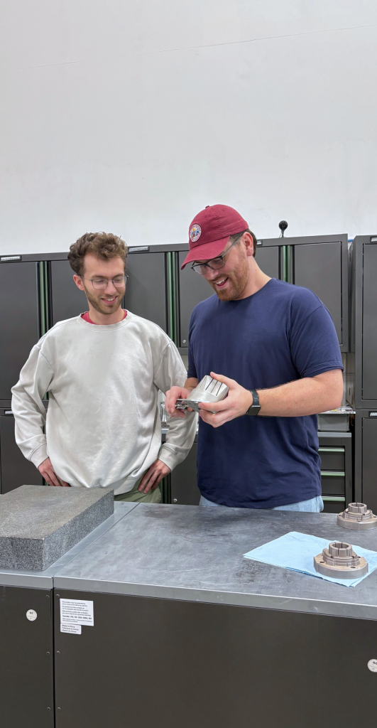 Next Chapter Manufacturing team members working on project